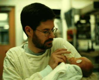 Wes feeding Liam in hospital